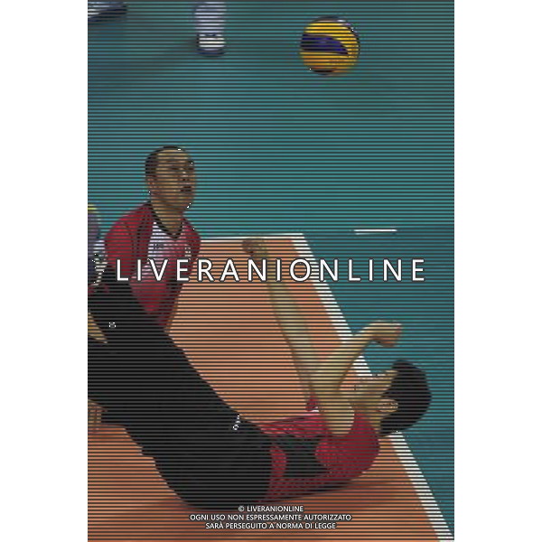 (101213) -- GUANGZHOU, Dec. 13, 2010 () -- Arata Yamamoto (R) of Japan competes during the preliminary pool B match of men\'s volleyball sitting against Iran at the Guangzhou 2010 Asian Para Games in Guangzhou, south China\'s Guangdong Province, on Dec. 13, 2010. Japan lost 0-3. (/Jiang Hongjing) AG. ALDO LIVERANI SAS ITALY ONLY
