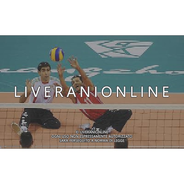 (101213) -- GUANGZHOU, Dec. 13, 2010 () -- Abolfazl Moharram Khani (R) of Iran competes during the preliminary pool B match of men\'s volleyball sitting against Japan at the Guangzhou 2010 Asian Para Games in Guangzhou, south China\'s Guangdong Province, on Dec. 13, 2010. Iran won 3-0. (/Jiang Hongjing) AG. ALDO LIVERANI SAS ITALY ONLY