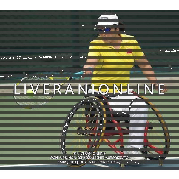 (101213) -- GUANGZHOU, Dec. 13, 2010 () -- Dong Fuli of China returns to Kanako Domori of Japan during the 1st round match of women\'s singles open of wheelchair tennis competition at the Guangzhou 2010 Asian Para Games in Guangzhou, south China\'s Guangdong Province, on Dec. 13, 2010. Dong Fuli won 2-0 to enter the next round. (/Yue Yuewei) AG. ALDO LIVERANI SAS ITALY ONLY