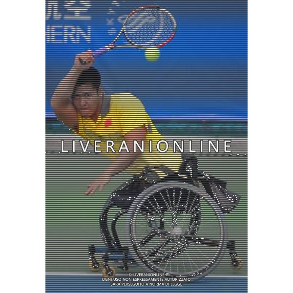 (101213) -- GUANGZHOU, Dec. 13, 2010 () -- Feng Xiaomin of China returns the ball to Tai Chia Yang of Chinese Taipei during the 1st round match of men\'s singles open of wheelchair tennis competition at the Guangzhou 2010 Asian Para Games in Guangzhou, south China\'s Guangdong Province, on Dec. 13, 2010. Feng Xiaomin won 2-0 to enter the next round. (/Yue Yuewei) AG. ALDO LIVERANI SAS ITALY ONLY