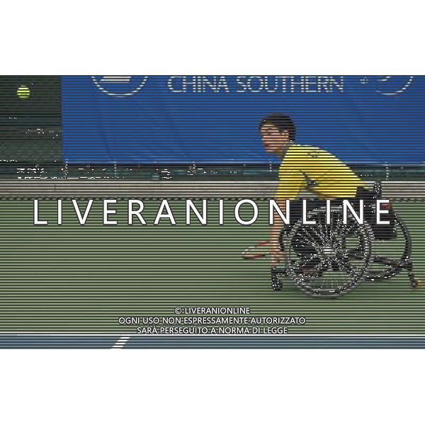 (101213) -- GUANGZHOU, Dec. 13, 2010 () -- Wei Zujun of China competes during the 1st round match of men\'s singles of wheelchair tennis competition against Kee King Hong of Malaysia at the Guangzhou 2010 Asian Para Games in Guangzhou, south China\'s Guangdong Province, on Dec. 13, 2010. Wei Zujun won 2-0 to enter the next round. (/Yue Yuewei) AG. ALDO LIVERANI SAS ITALY ONLY
