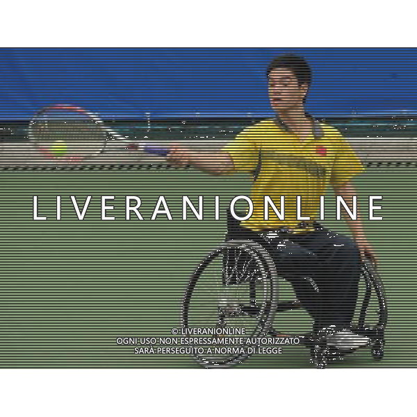 (101213) -- GUANGZHOU, Dec. 13, 2010 () -- Wei Zujun of China returns the ball to Kee King Hong of Malaysia during the 1st round match of men\'s singles of wheelchair tennis competition at the Guangzhou 2010 Asian Para Games in Guangzhou, south China\'s Guangdong Province, on Dec. 13, 2010. Wei Zujun won 2-0 to enter the next round. (/Yue Yuewei) AG. ALDO LIVERANI SAS ITALY ONLY