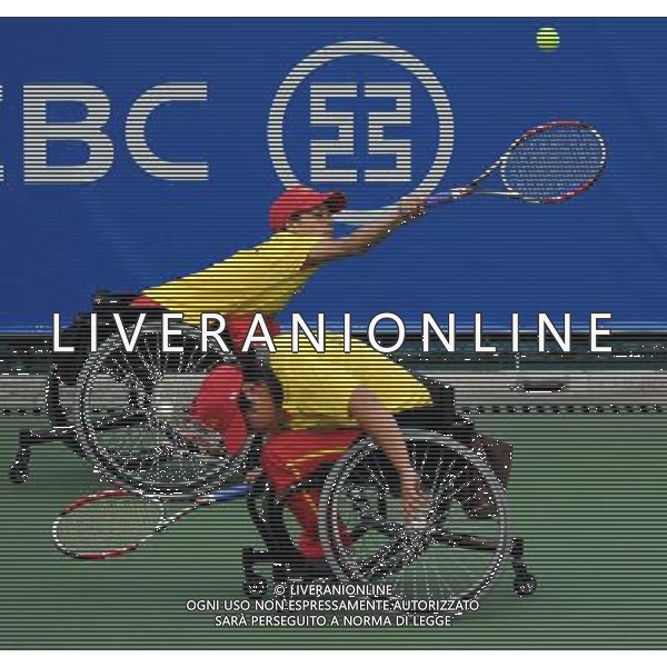 (101213) -- GUANGZHOU, Dec. 13, 2010 () -- Huang Huimin/Huang Jinlian (L) of China return to Lu Chia Yi/Wu Yi Shan of Chinese Taipei during the robin round Pool A match of women\'s doubles open of wheelchair tennis competition at the Guangzhou 2010 Asian Para Games in Guangzhou, south China\'s Guangdong Province, on Dec. 13, 2010. Huang Huimin/Huang Jinlian lost 0-2. (/Yue Yuewei) AG. ALDO LIVERANI SAS ITALY ONLY