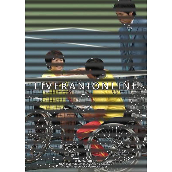 (101213) -- GUANGZHOU, Dec. 13, 2010 () -- Kanako Domori (L) of Japan shakes hands with Huang Huimin of China before the 1st round of women\'s singles open of wheelchair tennis at the Guangzhou 2010 Asian Para Games in Guangzhou, south China\'s Guangdong Province, on Dec. 13, 2010. Kanako Domori won 2-0. (/Yue Yuewei) AG. ALDO LIVERANI SAS ITALY ONLY