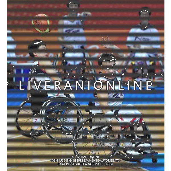 (101213) -- GUANGZHOU, Dec. 13, 2010 () -- Ko Kwangyub (R) of South Korea competes during the preliminary pool B match of men\'s wheelchair basketball competition against Kuwait at the Guangzhou 2010 Asian Para Games in Guangzhou, south China\'s Guangdong Province, on Dec. 13, 2010. South Korea won 112-17. (/Hao Tongqian) AG. ALDO LIVERANI SAS ITALY ONLY