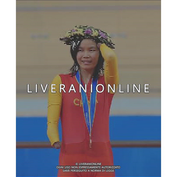 (101213) -- GUANGZHOU, Dec. 13, 2010 () -- Ruan Jianping of China reacts during the awarding ceremony of the mixed C1-5, M1KM\'W500M time trial final of cycling track competition at the Guangzhou 2010 Asian Para Games in Guangzhou, south China\'s Guangdong Province, on Dec. 13, 2010. Ruan won the bronze with 1 minute and 10.678 seconds. (/Lu Hanxin) AG. ALDO LIVERANI SAS ITALY ONLY
