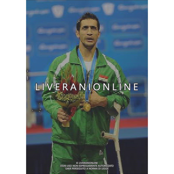 (101213) -- GUANGZHOU, Dec. 13, 2010 () -- Hussein Juboori of Iraq reacts during the awarding ceremony of the men\'s 52kg final of powerlifting competition at the Guangzhou 2010 Asian Para Games in Guangzhou, south China\'s Guangdong Province, on Dec. 13, 2010. Hussein Juboori won the gold medal with 167.5 kg. (/Fan Changguo) AG. ALDO LIVERANI SAS ITALY ONLY
