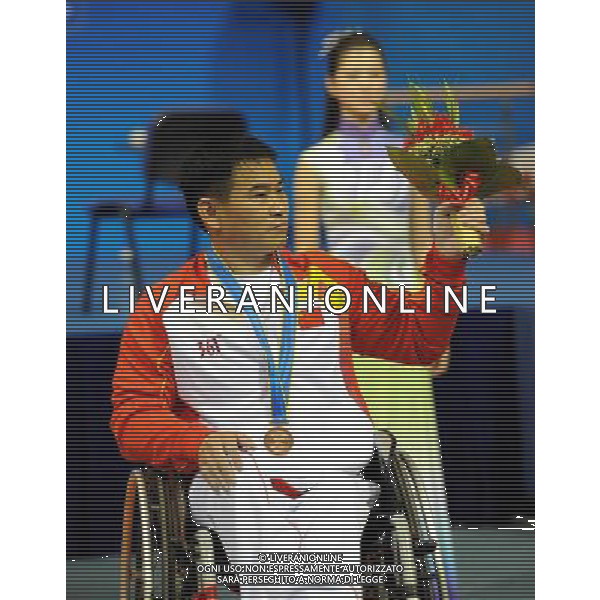 (101213) -- GUANGZHOU, Dec. 13, 2010 () -- Wang Jian of China reacts during the awarding ceremony of the men\'s 52kg final of powerlifting competition at the Guangzhou 2010 Asian Para Games in Guangzhou, south China\'s Guangdong Province, on Dec. 13, 2010. Wang Jian won the bronze medal with 162.5 kg. (/Fan Changguo) AG. ALDO LIVERANI SAS ITALY ONLY