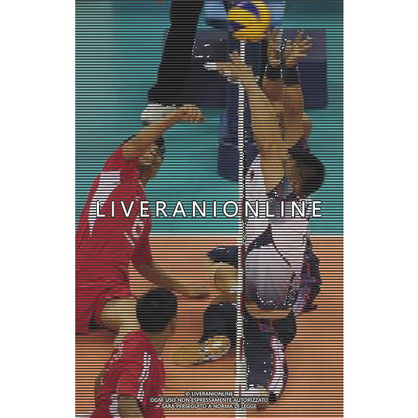 (101213) -- GUANGZHOU, Dec. 13, 2010 () -- Myo Myint Hlaing (L) of Myanmar competes during the preliminary pool B match of men\'s volleyball (sitting) against South Korea at the Guangzhou 2010 Asian Para Games in Guangzhou, south China\'s Guangdong Province, on Dec. 13, 2010. South Korea won 3-0. (/Jiang Hongjing) AG. ALDO LIVERANI SAS ITALY ONLY