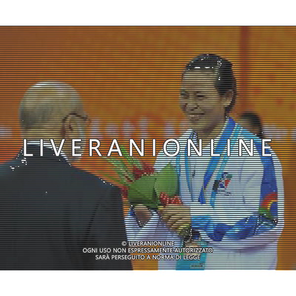 (101213) -- GUANGZHOU, Dec. 13, 2010 () -- Bronze medalist Surerut Komkeaw (R) of Thailand is congratulated during the awarding ceremony of the women\'s 400m freestyle s9 final at the Guangzhou 2010 Asian Para Games in Guangzhou, south China\'s Guangdong Province, on Dec. 13, 2010. (/Nie Jianjiang) AG. ALDO LIVERANI SAS ITALY ONLY