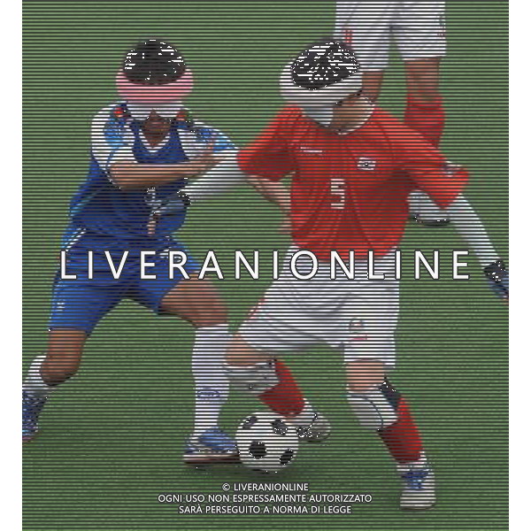 (101213) -- GUANGZHOU, Dec. 13, 2010 () -- Jiravat Samritrakpana (L) of Thailand competes during the preliminary of men\'s football 5-a-side against South Korea at the Guangzhou 2010 Asian Para Games in Guangzhou, south China\'s Guangdong Province, on Dec. 13, 2010. Thailand lost 2-3. (/Wang Song) AG. ALDO LIVERANI SAS ITALY ONLY
