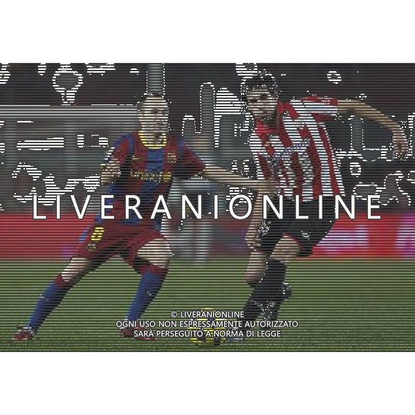 FC Barcelona\'s Andres Iniesta (l) and Atletic de Bilbao\'s Javi Martinez during King\'s Cup of Spain match.December 21,2010. (ALTERPHOTOS/Acero) - ALFAQUI - AG. ALDO LIVERANI SAS ITALY ONLY PARTITA CALCIO BARCELLONA vs ATLETICO DI BILBAO: COPPA DEL RE SPAGNA 2010