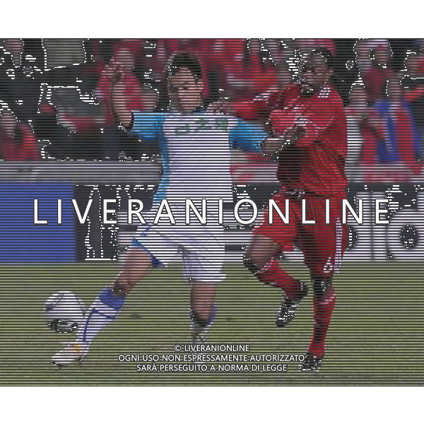 (110.104) - HONG KONG, 4 gen 2011 () - Li Zhihai (L) del Guangdong gareggia con Guy Ambassa Gerardo di Hong Kong durante il match seconda tappa del 33 ¡ Guangdong-Hong Kong Cup tra il team di Hong Kong e Squadra del Guangdong a Hong Kong AG.ALDO LIVERANI SAS ITALY ONLY