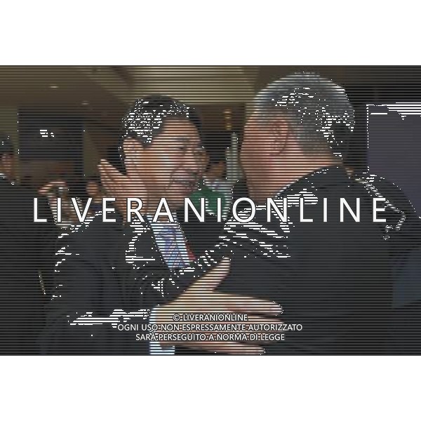 (110106) -- DOHA, Jan. 06, 2011 () -- AFC Vice President Zhang Jilong (L) reacts outside the venue of the 24th Asian Football Confederation (AFC) congress in Doha, capital of Qatar, Jan. 6, 2011. Zhang Jilong lost in the votes for the membership of the FIFA Executive Committee. (/Chen Shaojin) ©photoshot/Agenzia Aldo Liverani Sas - ITALY ONLY - 24mo congresso dell\'Asian Football Confederation (AFC) a Doha, capitale del Qatar, 6 gennaio 2011.