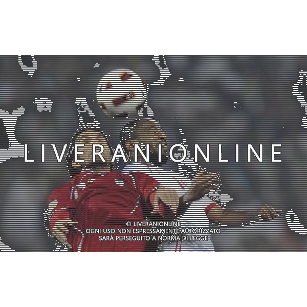 (110115) -- DOHA, Jan. 19, 2011 () -- Iranian player Mohammad Nouri (L) vies for the ball during the Asian Cup group D soccer match against the United Arab Emirates (UAE) in Doha, capital of Qatar, Jan. 19, 2011. Iran beat UAE 3-0. (/Tao Xiyi) (wjd) COPPA D\'ASIA 2011 GRUPPO D IRAN VS EMIRATI ARABI UNITI AG. ALDO LIVERANI SAS ITALY ONLY