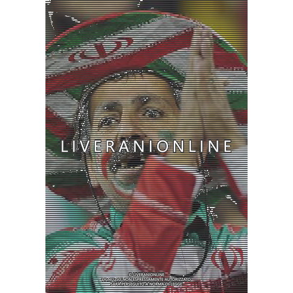 (110115) -- DOHA, Jan. 19, 2011 () -- An Iranian soccer fan watches the Asian Cup group D soccer match between Iran and the United Arab Emirates (UAE) in Doha, capital of Qatar, Jan. 19, 2011. Iran beat UAE 3-0. (/Tao Xiyi) (wjd) COPPA D\'ASIA 2011 GRUPPO D IRAN VS EMIRATI ARABI UNITI AG. ALDO LIVERANI SAS ITALY ONLY