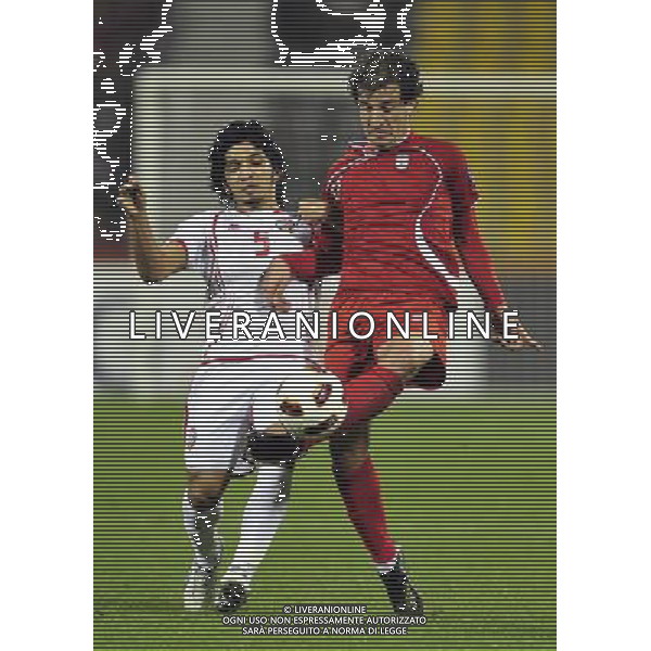 (110115) -- DOHA, Jan. 19, 2011 () -- Iranian player Ghasem Haddadifar (R) vies for the ball during the Asian Cup group D soccer match against the United Arab Emirates (UAE) in Doha, capital of Qatar, Jan. 19, 2011. Iran beat UAE 3-0. (/Tao Xiyi) (wjd) COPPA D\'ASIA 2011 GRUPPO D IRAN VS EMIRATI ARABI UNITI AG. ALDO LIVERANI SAS ITALY ONLY