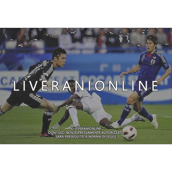 (110121) -- DOHA, Jan. 21, 2011 () -- Yusef Ahmed (C) of Qatar shoots during the 2011 Asian Cup quarter-final football match against Japan in Doha, capital of Qatar, Jan. 21, 2011. (/Tao Xiyi) /PHOTOSHOT/AG ALDO LIVERANI SAS - ASIAN CUP 2011 ITALY ONLY