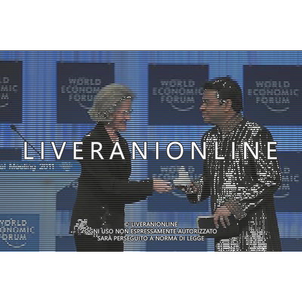 (110127) -- DAVOS, Jan. 27, 2011 () -- Chairperson of the Schwab Foundation for Social Entrepreneurship Hilde Schwab (L) presents the Crystal Award to Indian musician A. R. Rahman at the World Economic Forum (WEF) in Davos, Switzerland, Jan. 26, 2011. The Crystal Award was firstly established in 1995 by the WEF for those outstanding musicians who made great contribution to the international community. (/World Economic Forum) (lyx) ©PHOTOSHOT/Agenzia Aldo Liverani Sas - ITALY ONLY - EDITORIAL USE ONLY -