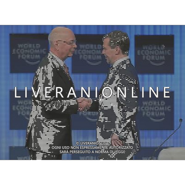 (110127) -- DAVOS, Jan. 27, 2011 () -- World Economic Forum founder and Executive Chairman Klaus Schwab (L) shakes hands with Russian President Dmitry Medvedev during the opening session of the World Economic Forum in Davos, Switzerland, Jan. 26, 2011. The 41st World Economic Forum kicked off here Wednesday with the theme of \'Shared Norms for the New Reality\'. More than 2,500 elites from over 100 countries will focus their discussions during the five-day meeting on four main topics: responding to the new reality, the economic outlook and defining policies for inclusive growth, supporting the G20 agenda and building a risk response network. (/World Economic Forum) (lyx) ©PHOTOSHOT/Agenzia Aldo Liverani Sas - ITALY ONLY - EDITORIAL USE ONLY -