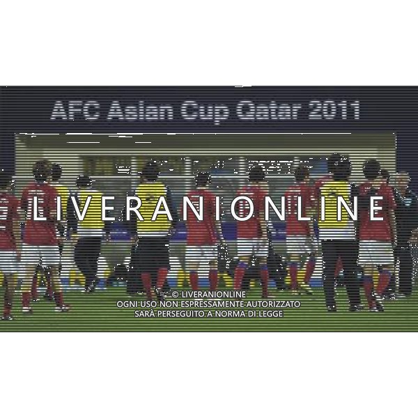 (110126) -- DOHA, Jan. 26, 2011 () -- Players of South Korea react after losing the semifinal match between Japan and South Korea at the Asian Cup in Doha, capital of Qatar, Jan. 25, 2011. Japan defeated South Korea 3-0 on penalties after a 2-2 draw to reach the Asian Cup final. (/Tao Xiyi)(xm) Doha , Coppa d\'Asia 2011 semifinali Giappone vs Corea del Sud AG. ALDO LIVERANI SAS ITALY ONLY