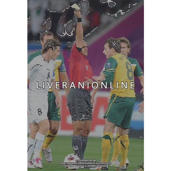 (110125) -- DOHA, Jan. 25, 2011 () -- Australia\'s Luke Wilkshire (R) receives a yellow card during the Asian Cup semifinal between Uzbekistan and Australia in Doha, capital of Qatar, Jan. 25, 2011. Australia won 6-0 and advanced to the final. (/Chen Shaojin) (zw) Doha Coppa d\'Asia 2011 Uzbekistan vs Australia AG. ALDO LIVERANI SAS ITALY ONLY