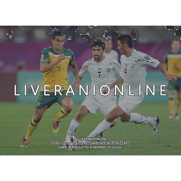 (110126) -- DOHA, Jan. 26, 2011 (Xinhua) -- Timothy Cahill (L) of Australia vies with Azizbek Haydarov (C) and Anzur Ismailov(R) of Uzbekistan during the Asian Cup semifinal match between Uzbekistan and Australia in Doha, capital of Qatar, Jan. 25, 2011. Australia won 6-0 and advanced to the final. (Xinhua/Chen Shaojin) (xm) Doha Coppa d\'Asia 2011 Uzbekistan vs Australia AG. ALDO LIVERANI SAS ITALY ONLY