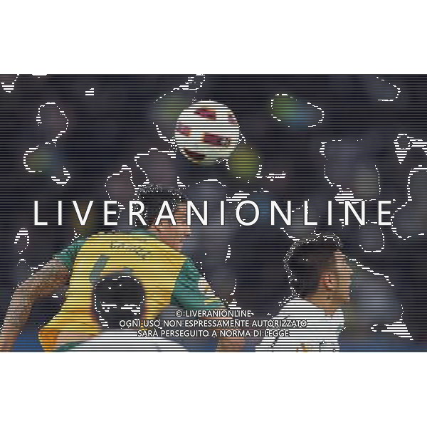 (110126) -- DOHA, Jan. 26, 2011 (Xinhua) -- Timothy Cahill (top) of Australia heads the ball during the Asian Cup semifinal match between Uzbekistan and Australia in Doha, capital of Qatar, Jan. 25, 2011. Australia won 6-0 and advanced to the final. (Xinhua/Chen Shaojin) (xm) Doha Coppa d\'Asia 2011 Uzbekistan vs Australia AG. ALDO LIVERANI SAS ITALY ONLY