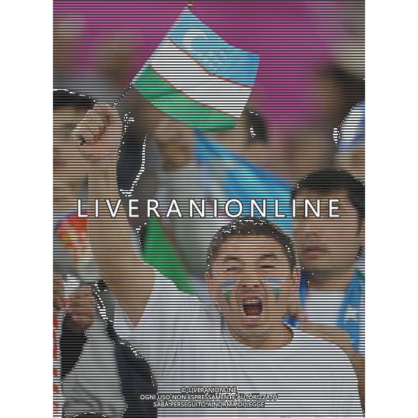 (110126) -- DOHA, Jan. 26, 2011 () -- A supporter of Uzbekistan team cheers during the Asian Cup semifinal match between Uzbekistan and Australia in Doha, capital of Qatar, Jan. 25, 2011. Australia won 6-0 and advanced to the final. (/Chen Shaojin) (xm) Doha Coppa d\'Asia 2011 Uzbekistan vs Australia AG. ALDO LIVERANI SAS ITALY ONLY