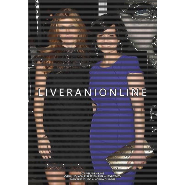 Connie Britton and Carla Gugino Photo by Gilbert Flores \'The Rite\' World Premiere at the Grauman\'s Chinese Theatre January 26, 2011 - Hollywood, California AG. ALDO LIVERANI SAS ITALY ONLY *** Local Caption ***