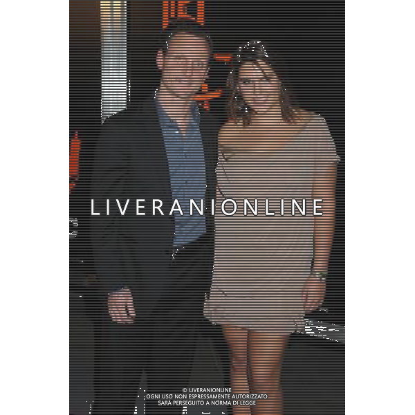 25 January 2011 - Hollywood, California - Tony Goldwyn and guest. \'The Mechanic\' Los Angeles Premiere held at Arclight Cinemas. Photo Credit: Byron Purvis/AdMedia AG. ALDO LIVERANI SAS ITALY ONLY