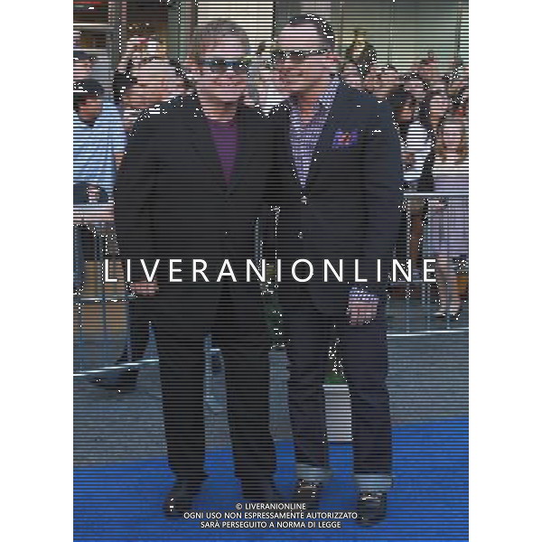 23 January 2011 - Hollywood, CA - Elton John and David Furnish. Gnomeo And Juliette World Premiere held At The El Capitan Theatre. Photo Credit: Kevan Brooks/AdMedia AG. ALDO LIVERANI SAS ITALY ONLY
