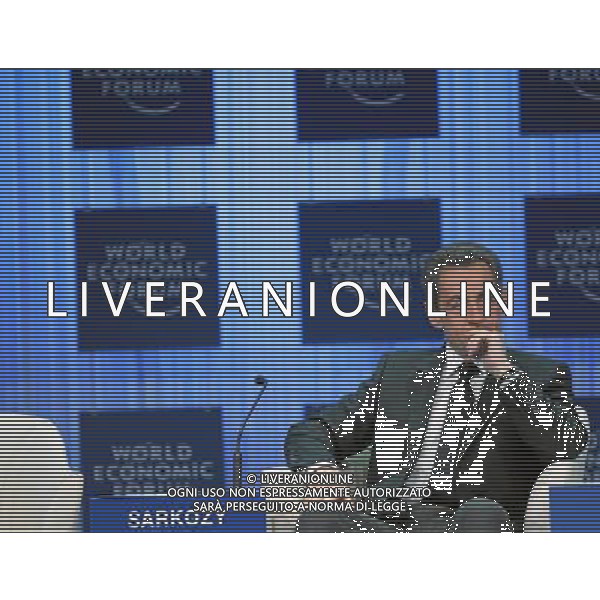 DAVOS/SWITZERLAND, 27JAN11 - Nicolas Sarkozy, President of France, is listening during the speech of Klaus Schwab, Founder and Executive Chairman, World Economic Forum during the session \'Vision for the G20\' at the Annual Meeting 2011 of the World Economic Forum in Davos, Switzerland, January 27, 2011. World Economic Forum ©PHOTOSHOT/Agenzia Aldo Liverani Sas - ITALY ONLY - EDITORIAL USE ONLY -