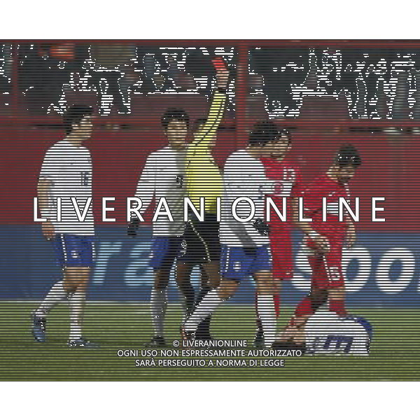 Friendly soccer match between Turkey and South Korea at Avni Aker Stadium in Trabzon, Turkey on February 09, 2011 match scored: Turkey 0 - South Korea 0 NELLA FOTO Emre Belozoglu (L) of Turkey and Ja Cheol Koo (R) of South Korea and referee Sergiy Boyko FOT. SESKIM/NEWSPIX.PL /ALDO LIVERANI S A S ONLY ITALY 