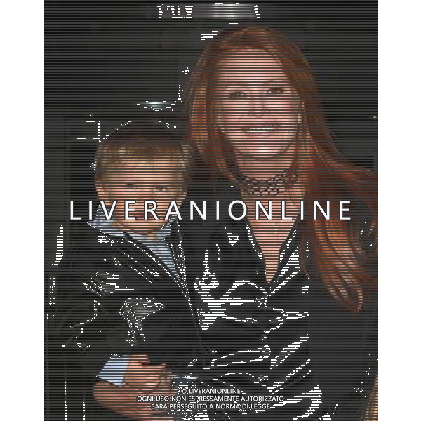 8 February 2011 - Los Angeles, California - Angie Everhart and Son Kayden. \'Justin Bieber: Never Say Never\' Los Angeles Premiere held At Nokia Theatre L.A Live. Photo Credit: Kevan Brooks/AdMedia AG. ALDO LIVERANI SAS ITALY ONLY *** Local Caption ***