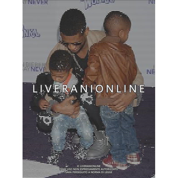Usher, sons Usher V and Naviyd Photo by Janet Gough \'Justin Bieber: Never Say Never\' Los Angeles Premiere at the Nokia Theater L.A. Live February 8, 2011 - Los Angeles, California AG. ALDO LIVERANI SAS ITALY ONLY *** Local Caption ***