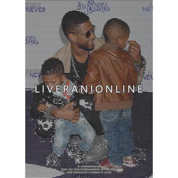 Usher, sons Usher V and Naviyd Photo by Janet Gough \'Justin Bieber: Never Say Never\' Los Angeles Premiere at the Nokia Theater L.A. Live February 8, 2011 - Los Angeles, California AG. ALDO LIVERANI SAS ITALY ONLY *** Local Caption ***