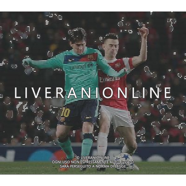  16.02.2011 - LONDON - UEFA CHAMPIONS LEAGUE MATCH - LEG 1 - ARSENAL V BARCELONA - EMIRATES STADIUM - ARSENAL - LONDON NELLA FOTO Barcelona\'s Lionel Messi battles with Arsenal\'s Laurent Koscielny FOTO MICHAL ZEMANEK/NEWSPIX.PL AG ALDO LIVERANI ONLY ITALY 