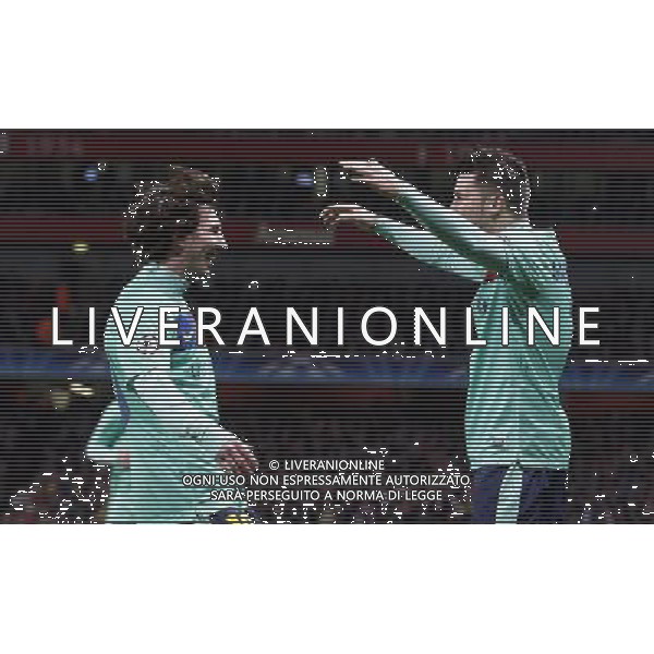 Barcelona\'s David Villa (right) celebrates his goal with Lionel Messi during the UEFA Champions League first round of 16 match between Arsenal and Barcelona FC in the Emirates Stadium, north London, Britain, 16 February 2011. AG. ALDO LIVERANI SAS ITALY ONLY