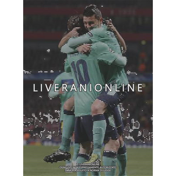 Barcelona\'s David Villa (right) celebrates his goal with Lionel Messi during the UEFA Champions League first round of 16 match between Arsenal and Barcelona FC in the Emirates Stadium, north London, Britain, 16 February 2011. AG. ALDO LIVERANI SAS ITALY ONLY