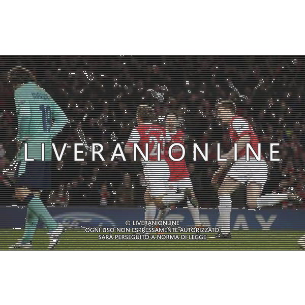 Arsenal\'s Andrey Arshavin (centre) celebrates his goal against Barcelona during the UEFA Champions League first round of 16 match between Arsenal and Barcelona FC in the Emirates Stadium, north London, Britain, 16 February 2011. AG. ALDO LIVERANI SAS ITALY ONLY