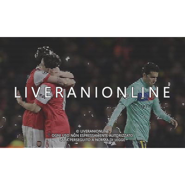 Arsenal\'s players (right) celebrate their victory over Barcelona in the UEFA Champions League first round of 16 match between Arsenal and Barcelona FC in the Emirates Stadium, north London, Britain, 16 February 2011. AG. ALDO LIVERANI SAS ITALY ONLY
