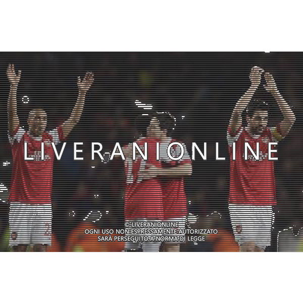 Arsenal\'s players with Cesc Fabregas (right) celebrate their victory over Barcelona in the UEFA Champions League first round of 16 match between Arsenal and Barcelona FC in the Emirates Stadium, north London, Britain, 16 February 2011. AG. ALDO LIVERANI SAS ITALY ONLY