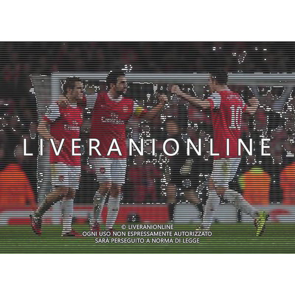 (110217) -- LONDON, Feb. 17, 2011 () -- Robin van Persie(1st R) of Arsenal celebrates his goal with teammate during their UEFA Champions League match against Barcelona at the Emirates Stadium in London, Britain, Feb. 16, 2011. Arsenal won by 2-1. (/Zeng Yi) AG. ALDO LIVERANI SAS ITALY ONLY