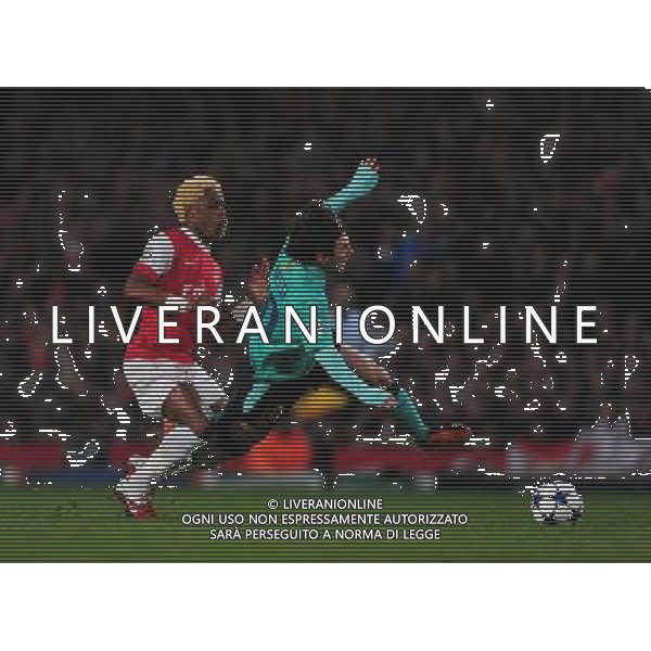 (110217) -- LONDON, Feb. 17, 2011 () -- Arsenal\'s Alex Song (L) vies the ball against Lionel Messi of Barcelona during their UEFA Champions League match against Barcelona at the Emirates Stadium in London, Britain, Feb. 16, 2011. Arsenal won by 2-1. (/Zeng Yi) AG. ALDO LIVERANI SAS ITALY ONLY