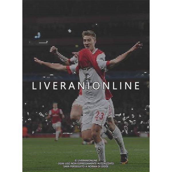 (110217) -- LONDON, Feb. 17, 2011 () -- Andrey Arshavin (bottom) of Arsenal celebrates his goal with teammate Nicklas Bendtner during their UEFA Champions League match against Barcelona at the Emirates Stadium in London, Britain, Feb. 16, 2011. Arsenal won by 2-1. (/Zeng Yi) AG. ALDO LIVERANI SAS ITALY ONLY
