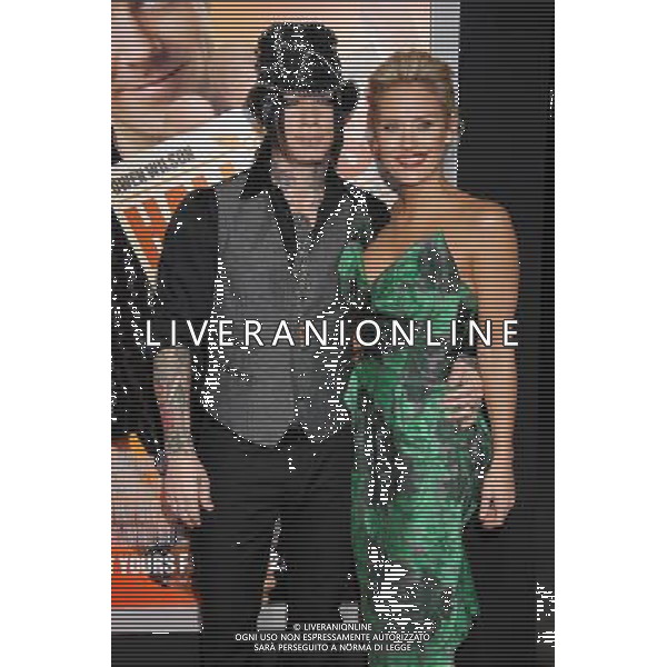 D.J. Ashba and Nicky Whelan Photo by Janet Gough \'Hall Pass\' World Premiere at the ArcLight Hollywood Cinemas February 23, 2011 - Hollywood, California ©photoshot/AG ALDO LIVERANI SAS - ITALY ONLY - *** Local Caption *** .