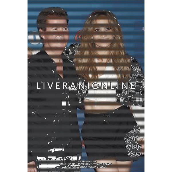 Simon Fuller and Jennifer Lopez Photo by Janet Gough \'American Idol\' Season 10 Finalists Party at The Grove Rooftop Parking Structure March 3, 2011 - Los Angeles, California WORLD RIGHTS excluding USA, South Africa, Australia and Germany AG. ALDO LIVERANI SAS ITALY ONLY *** Local Caption *** .