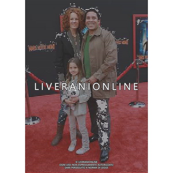 6 March 2011 - Hollywood, California - Oscar Nunez (R) and wife Carla Nunez and Daughter. \'Mars Needs Moms 3D\' Los Angeles Premiere Held At The EL Capitan Theatre. Photo Credit: Kevan Brooks/AdMedia AG. ALDO LIVERANI SAS ITALY ONLY *** Local Caption *** .
