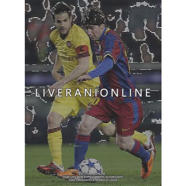 BarcelonaÇs Lionel Messi leads the ball past ArsenalÇs Cesc Fabregas during the UEFA Champions League second round of 16 match between Barcelona FC and Arsenal in the Nou Camp Stadium, Barcelona, Spain, 8 March 2011. ©photoshot/Agenzia Aldo Liverani Sas - ITALY ONLY - FC Barcelona - Arsenal secondo turno di UEFA Champions League 16 match Camp Nou, Barcellona, Spagna, 8 marzo 2011. 